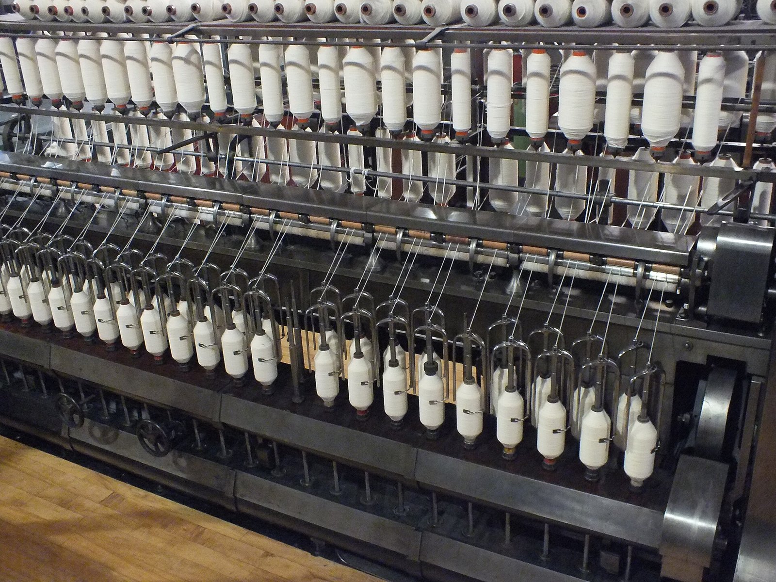 Ring spinning frame with yarn bobbins in a textile mill